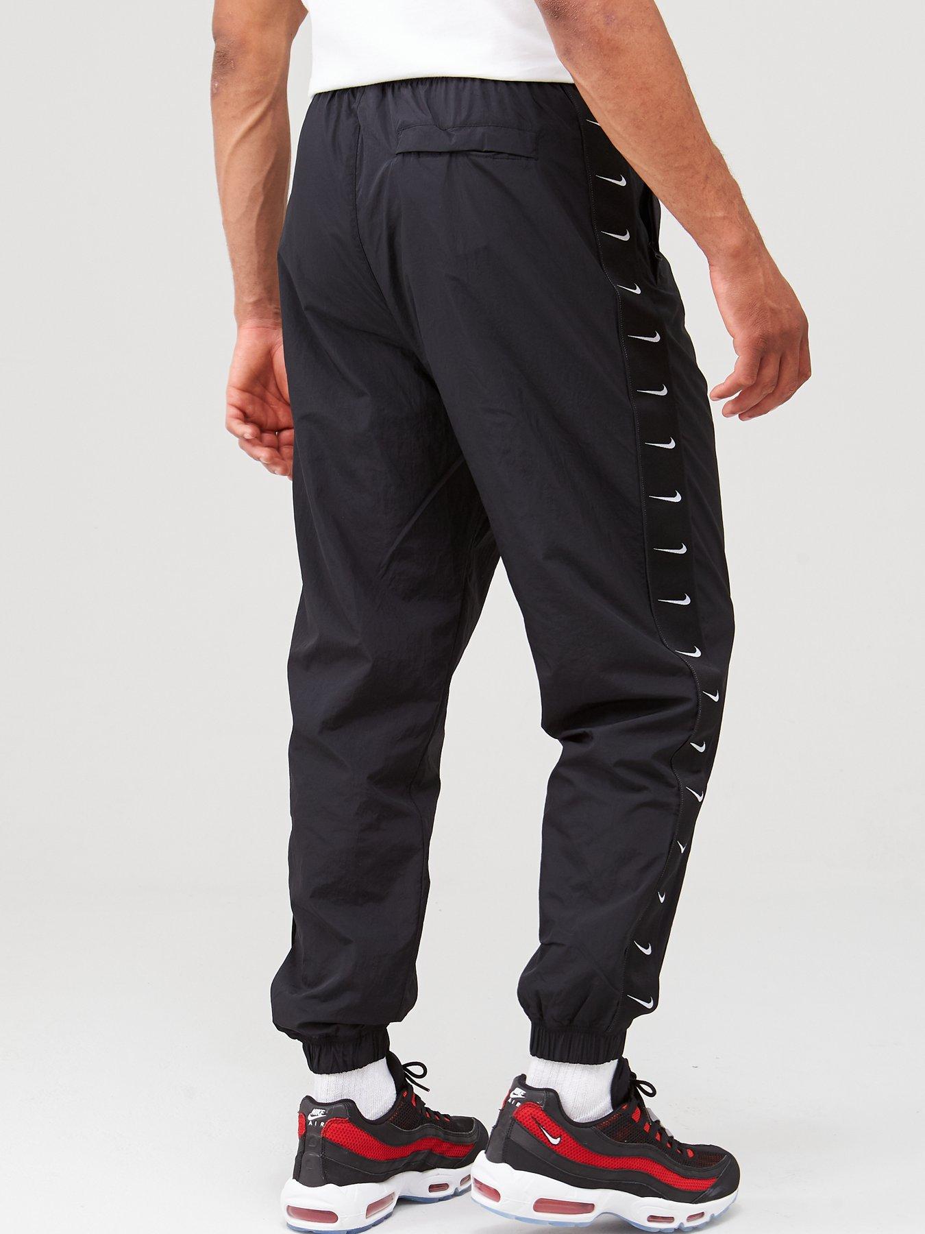 nike black swoosh woven joggers