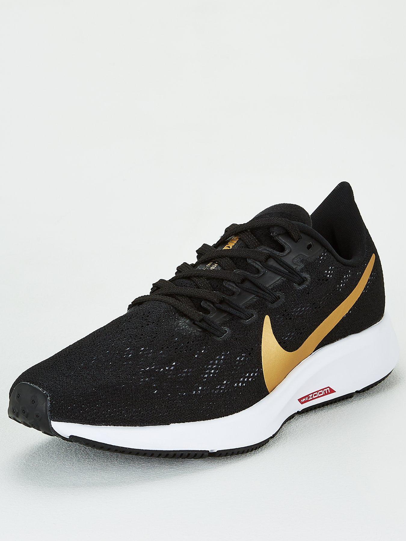 nike running pegasus 36 trainers in black with gold swoosh