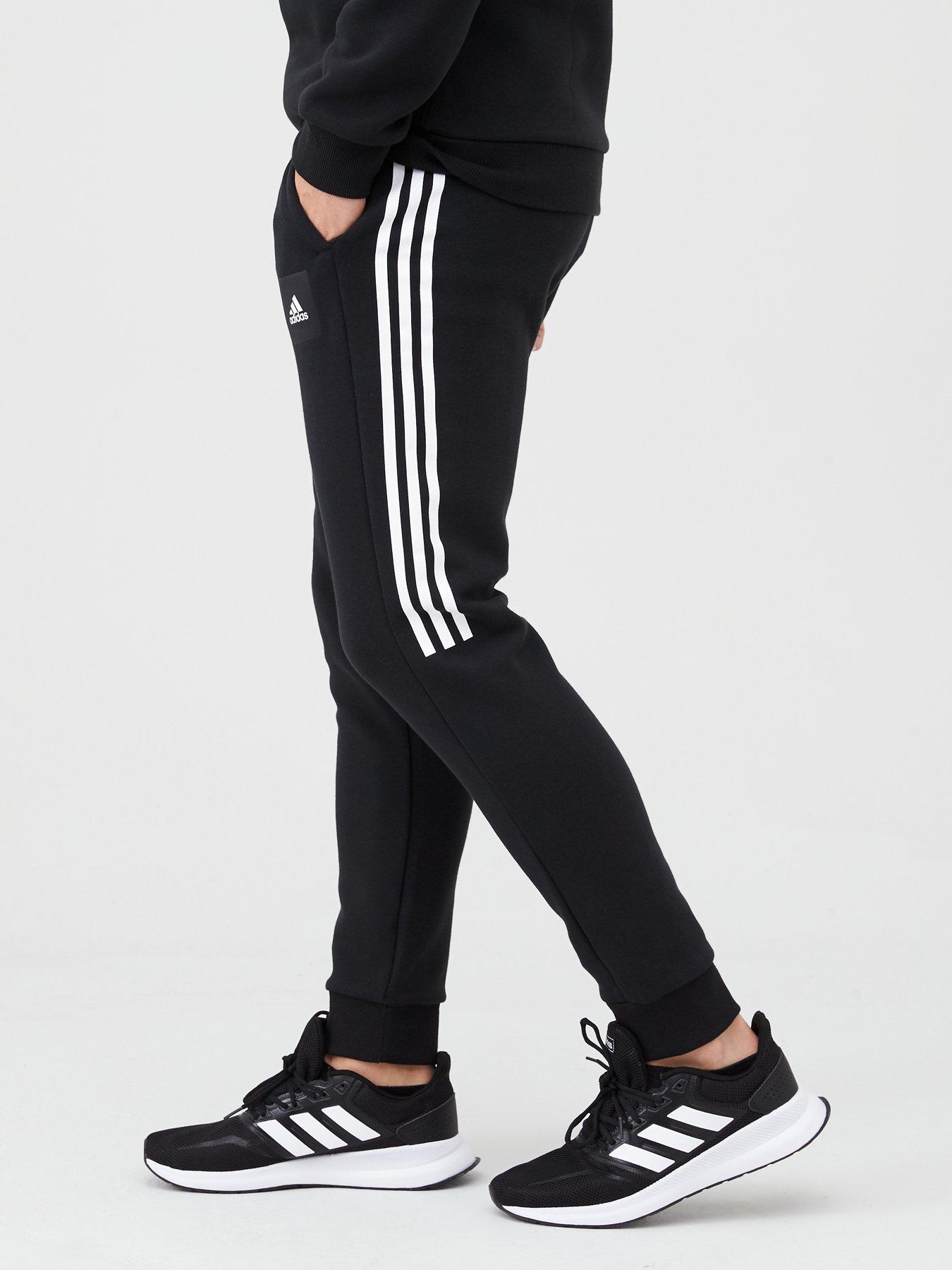 adidas track pants half stripe