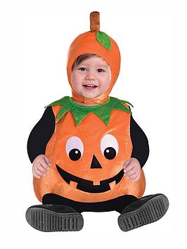 Kid wearing pumpkin Halloween costume
