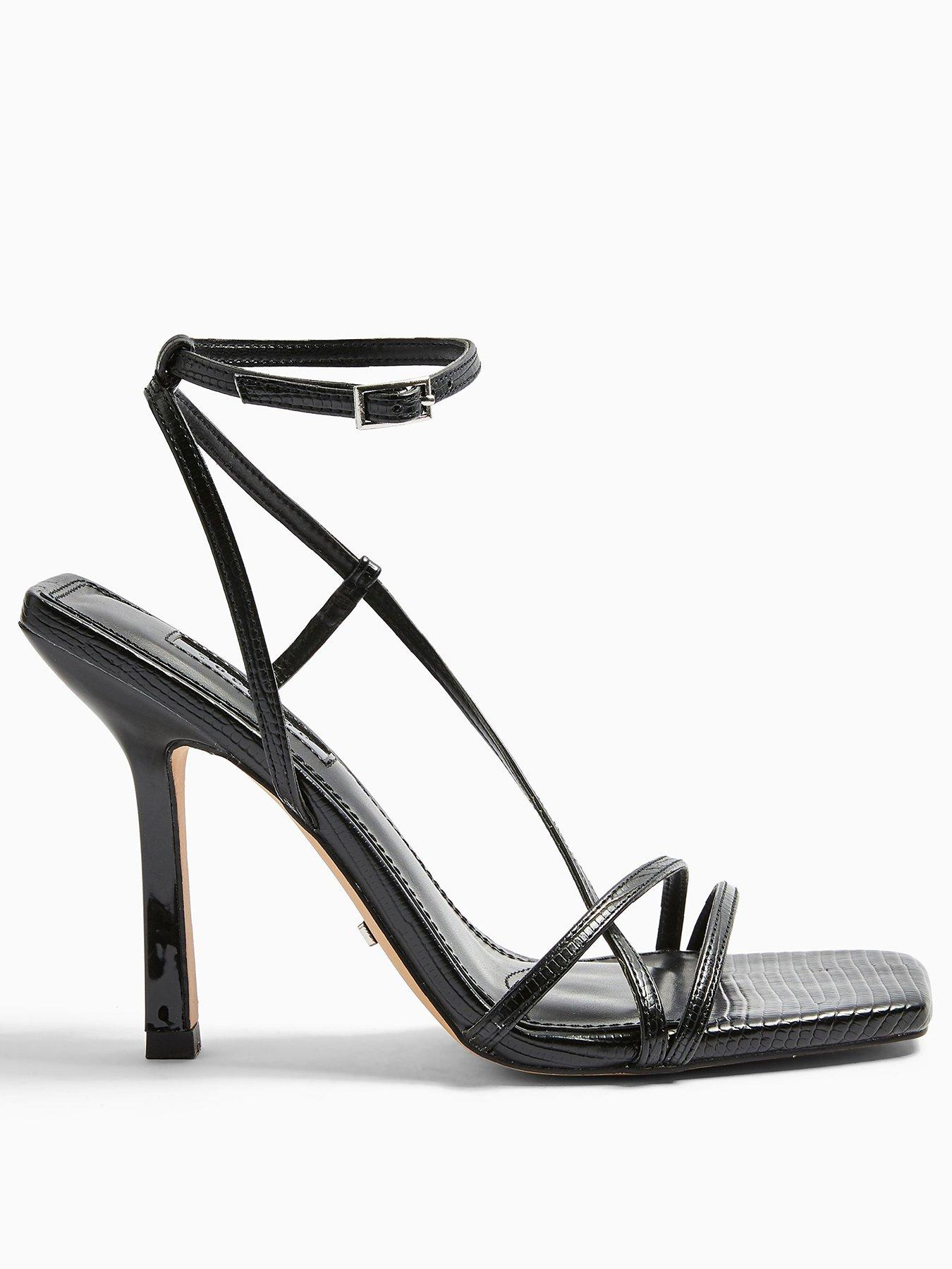 very strappy heels