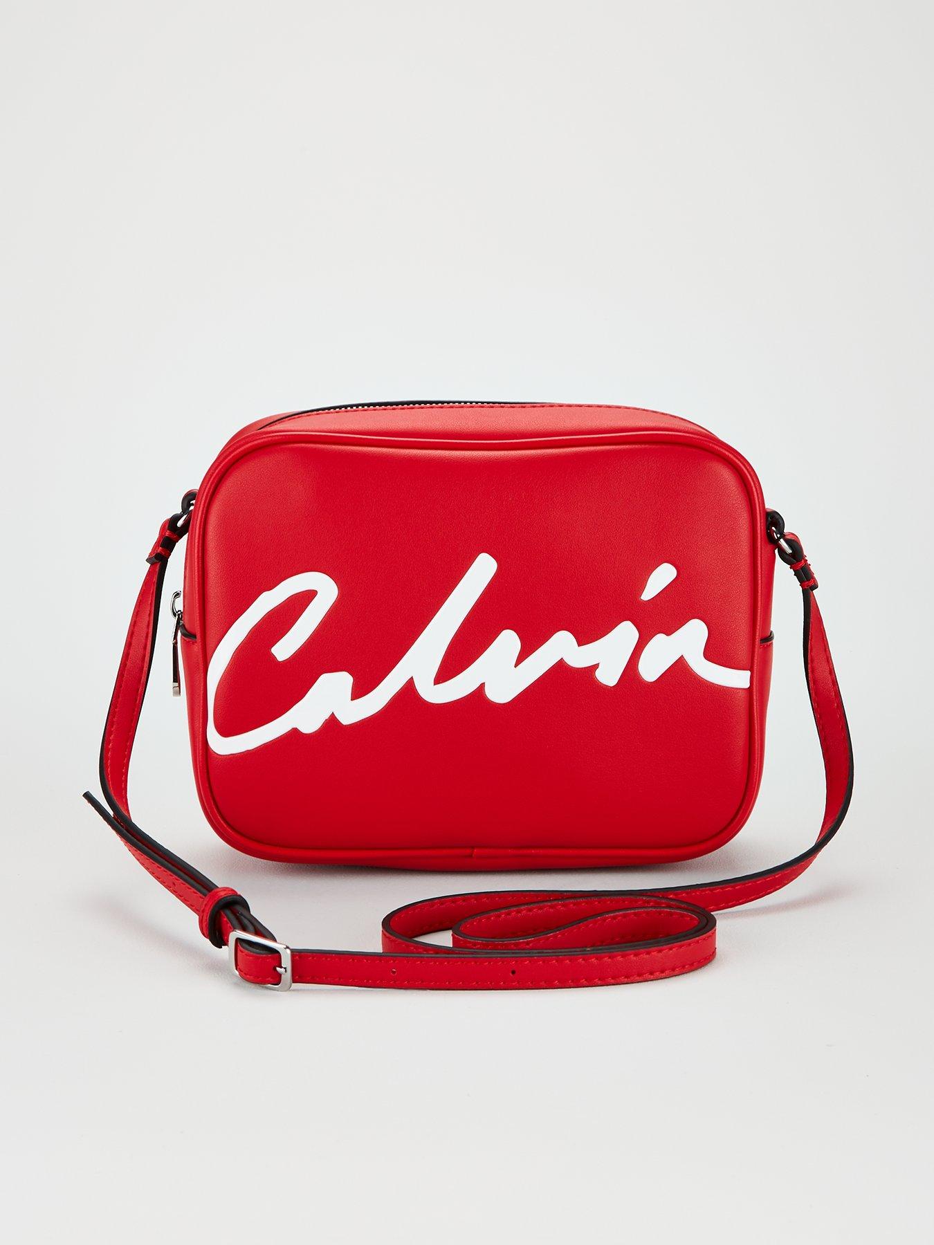 red calvin klein luggage