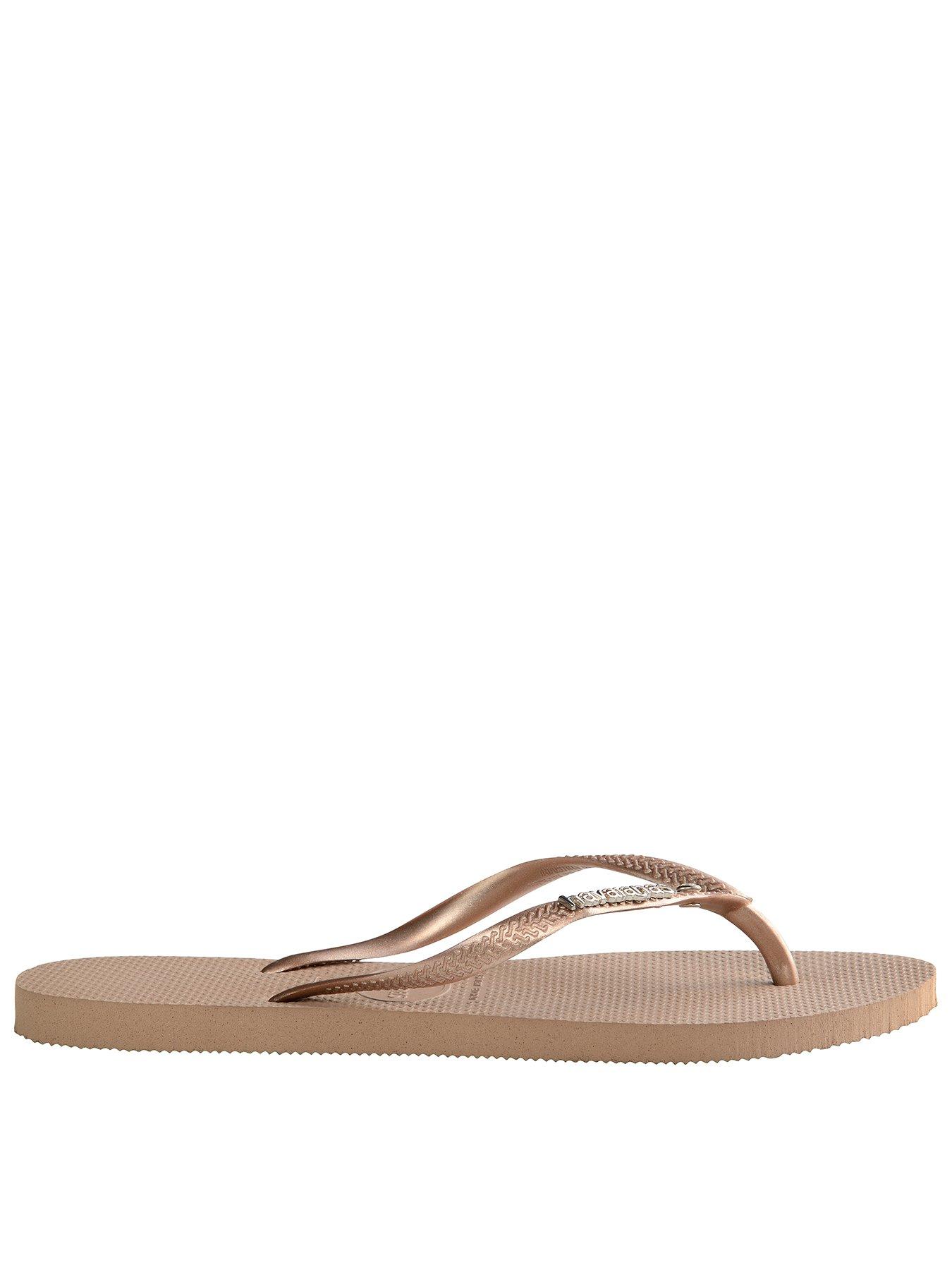 havaianas with gold metal logo