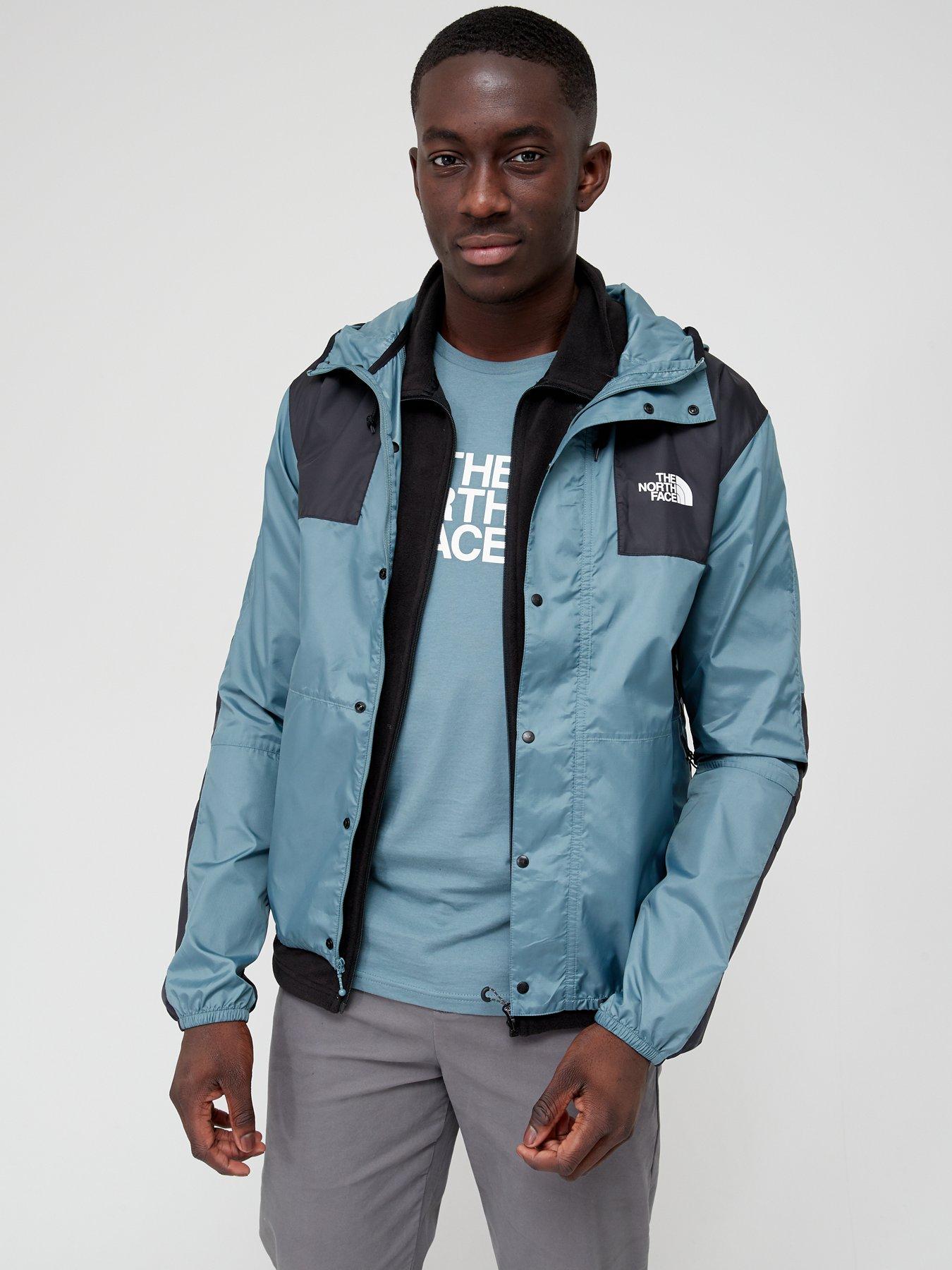 black and turquoise north face jacket